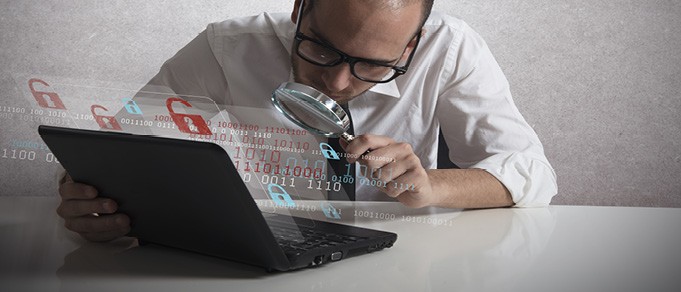 a man is doing a quality assurance while using magnifine glass